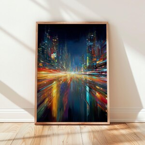 May include: Abstract cityscape art print in a wooden frame. The artwork features a vibrant, colourful depiction of a city at night, with streaks of light and reflections in shades of blue, orange, yellow, and red. The frame is a light brown colour.