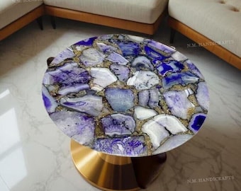 May include: A round side table with a purple and white agate stone top and a gold metal base.