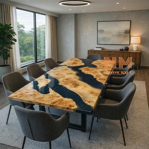 May include: A large, rectangular dining table with a unique design. The tabletop features a natural wood grain pattern with a dark blue river of resin running through the center. The table is surrounded by eight gray upholstered chairs.