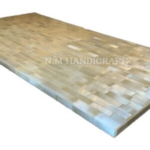 May include: A rectangular table top made of white and beige tiles. The tiles are arranged in a pattern of horizontal rows. The table top is made by NM Handicrafts.