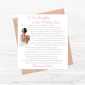 May include: A pink and white wedding card with a bride illustration and a message to a daughter on her wedding day. The card reads "To Our Daughter on her Wedding Day" and includes the text "We're so very proud of you Hayley, in all you say and do, the way you live your life and you simply being you."  The card is signed "Mum and Dad."