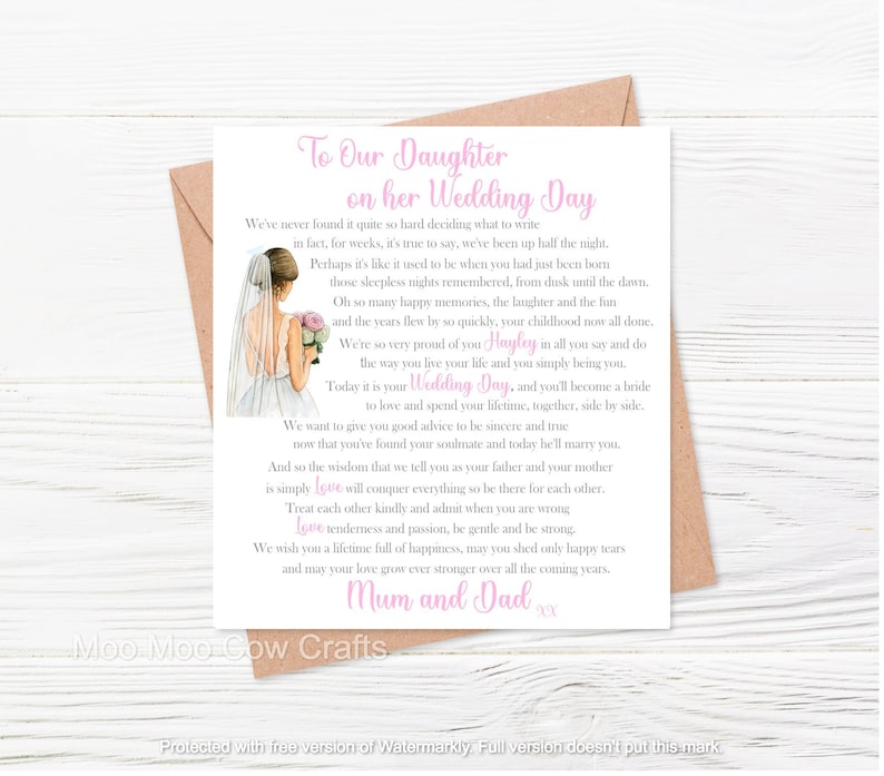wooden background with brown envelope and white square with a clip art image of a bride with text, it's a wedding card.