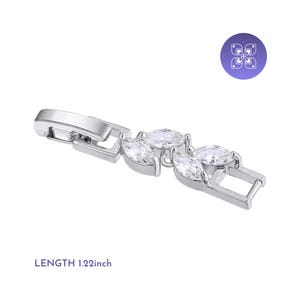 May include: A silver-toned bracelet clasp with three clear, oval-shaped gemstones. The clasp is 1.22 inches in length and features a secure closure mechanism. The gemstones are set in a decorative pattern.