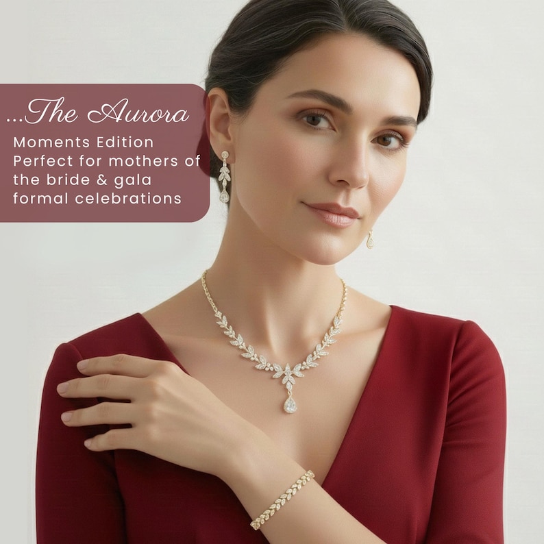 Elegant mature woman wearing The Aurora floral vine Swarovski crystal necklace, earrings and bracelet by Areshna™, 18K white gold bridal jewelry set, in a deep red elegant dress. Perfect for mothers of the bride & groom, galas and formal celebrations, timeless sustainable luxury.