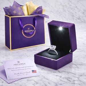 Luxury Areshna™ jewelry unboxing: LED lighted purple velvet ring box with High-Carbon lab diamond hybrid ring. Premium boutique packaging with a designer boutique shopping bag, and gold foil tissue paper and Boston Woman-Owned business certification. Ideal for anniversary and proposal gifts. Gift-ready packaging with Same Day Shipping from our Boston studio.