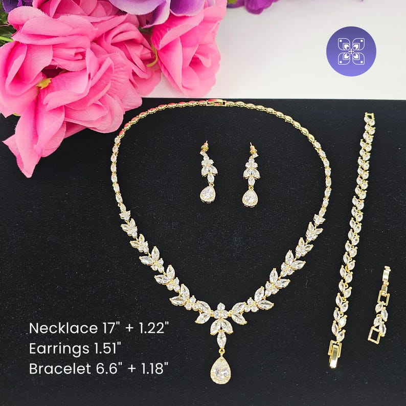 The Aurora Swarovski crystal jewelry set with exact dimensions — 17-inch necklace, 1.5-inch earrings, and 6.6-inch bracelet. Handcrafted by Areshna™.