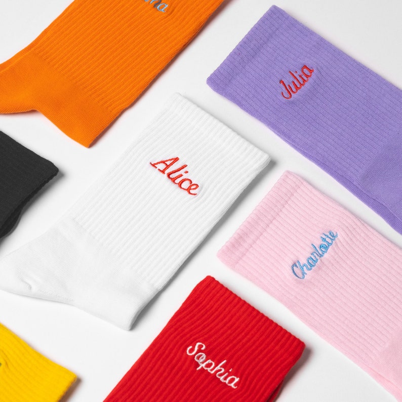 Selection of womens socks in different colours with personalised names embroidered on them