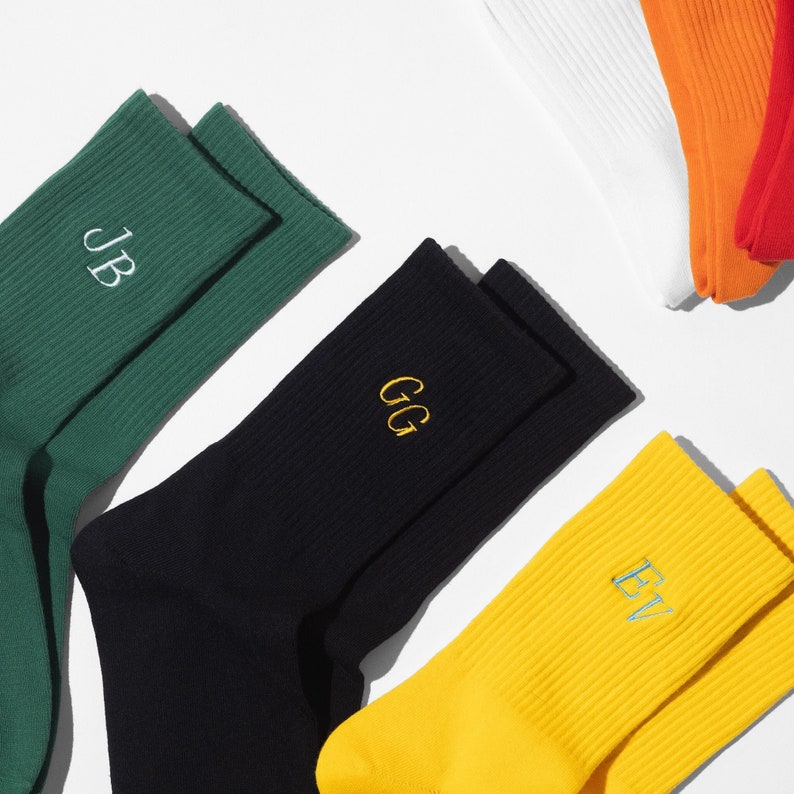 Cotton casual ribbed unisex socks in green, black and yellow. Socks have custom embroidered initials.
