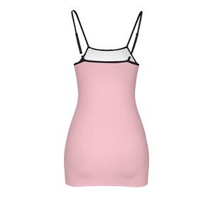May include: A pink sleeveless mini dress with thin black straps.
