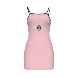 May include: A pink sleeveless dress with a black trim and a gold and black graphic of a queen of spades playing card.
