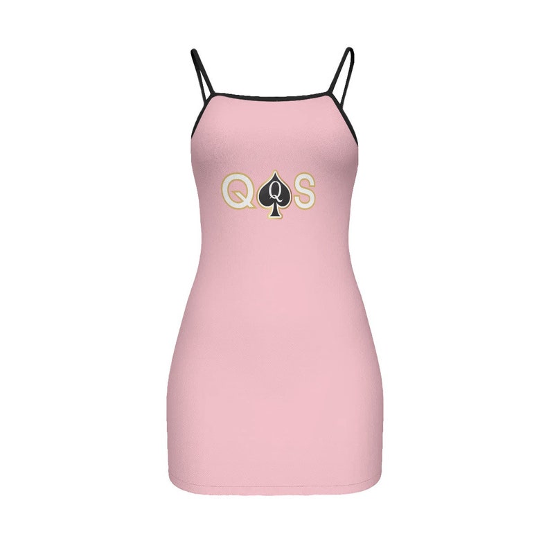 May include: A pink sleeveless dress with a black trim and a gold and black graphic of a queen of spades playing card.