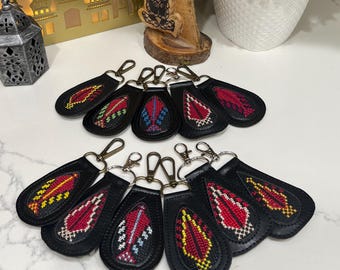 Tatreez key chains with a leather frame and back
