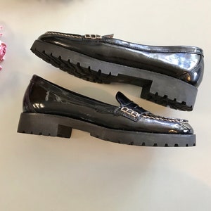 These vintage SPERRY TOP-SiDER pENNY LOAFERS are in EXCELLENT condition 'cause they've NEVER been worn!  They're shiny black patent leather with white stitching and of course, the slot to stick a penny in.  Black lug soles of non-marking rubber.  They're VERY clean with NO wear.  Size 7.5.