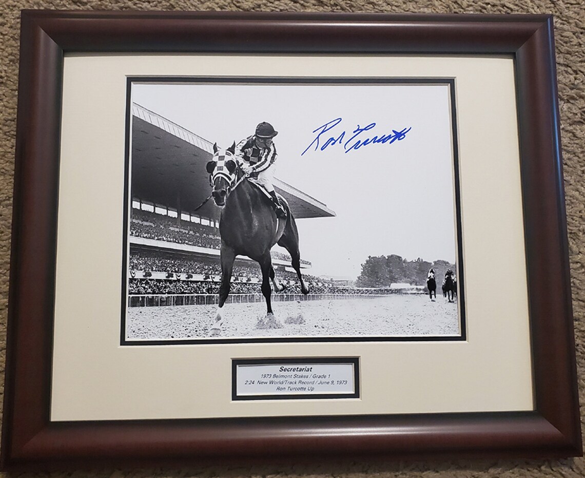 Jockey Ron Turcotte sits atop of Secretariat racing in the lead at