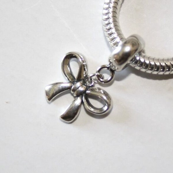 Bow / Ribbon / Butterfly Knot. Dangle bead charm / Pendant. Solid 925 sterling silver. For European style bracelets