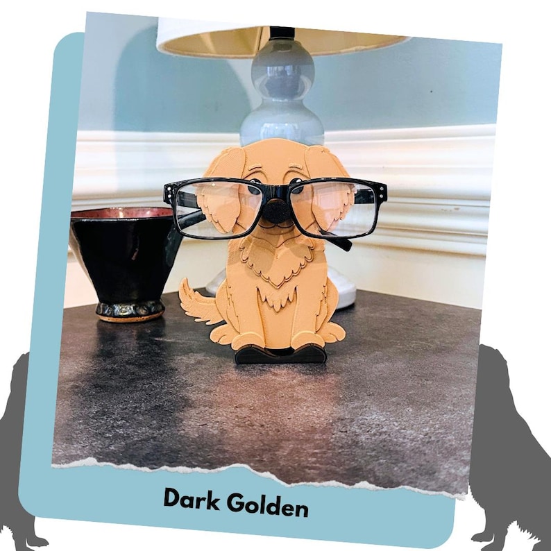 May include: A wooden dog figurine wearing glasses, painted in a dark golden colour. The figurine is sitting on a table with a bowl and a lamp in the background. The text "Dark Golden" is visible at the bottom of the image.