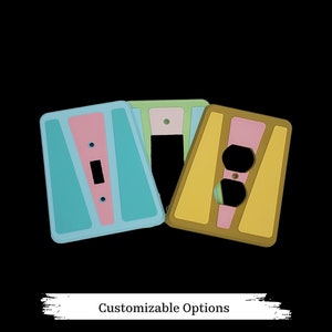 May include: Three decorative light switch and outlet covers in a retro style. The covers are in shades of blue, green, pink, and yellow. The covers are customizable.