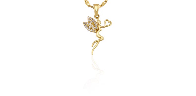 May include: A gold-colored pendant necklace featuring a fairy design. The fairy has crystal-studded wings and is holding a heart. The necklace chain is also gold-colored.