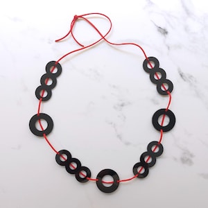 Modern Black Acrylic Ring Necklace: Red Suede Cord, Lightweight Jewelry