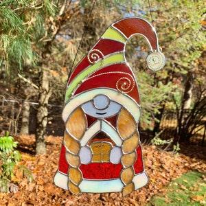 Christmas Lady Gnome holding a toy house - Stained Glass Suncatcher