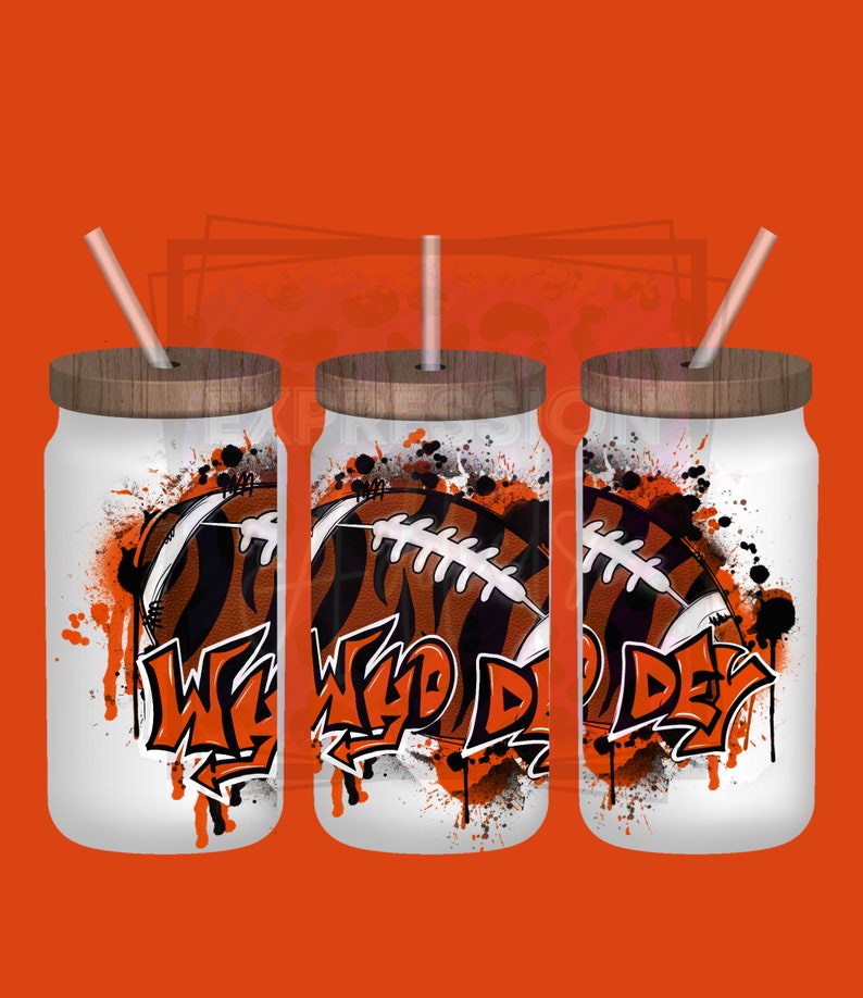 May include: Three white glass tumblers with wooden lids and straws. Each tumbler features a football design with orange and black stripes and the words "Who Dey" in graffiti style. The background is orange.