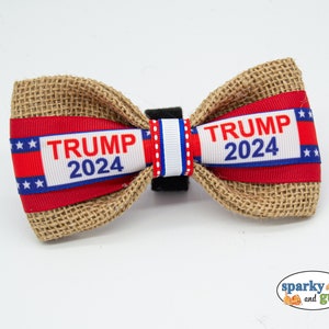 May include: A brown burlap bow tie with red, white, and blue ribbon featuring the text "TRUMP 2024".