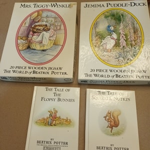 May include: Four vintage Beatrix Potter jigsaw puzzles and books. The puzzles feature Mrs. Tiggy-Winkle, Jemima Puddle-Duck, The Tale of the Flopsy Bunnies, and The Tale of Squirrel Nutkin. Each puzzle is 20 pieces and made of wood.