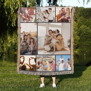 May include: A woven tapestry blanket featuring a collage of family photos. The blanket has a fringed edge and displays various family portraits in a grid pattern. The photos show people of different ages and ethnicities.