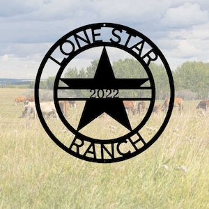 May include: Black metal Lone Star Ranch sign with a five-pointed star and the year 2022.