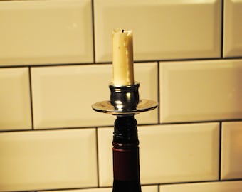 IV WINELIGHT: bottle top candle holder.