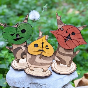 Handmade wooden Koroks from the Legend of Zelda. Hand-painted wooden forest spirits, the perfect geek gift for gamers.