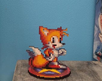 Tails wooden figurine from Sonic Mania. A small pixel art figurine, the perfect gift for decorating a geeky gaming room!