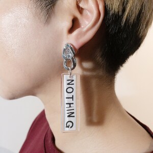 Original graphic art earrings - NOTHING 2021 - Unique earrings - Chunky word earrings - Gold/Silver chain - One of a kind jewellery