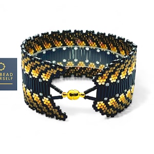 May include: A black and gold beaded bracelet with a geometric pattern. The bracelet has a clasp closure.