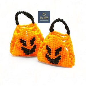 May include: Two small orange pumpkin-shaped bags with black handles and black smiling faces. The bags are made of beads and are perfect for trick-or-treating.