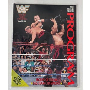 May include: A WWF wrestling program cover featuring wrestlers in action. The cover includes the WWF logo, text that reads "What the World is Watching," and "Legion of Doom Tag Team Champions."