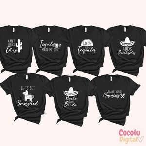May include: Set of ten black t-shirts with white text and graphics. The shirts feature various phrases and designs related to the Mexican holiday Cinco de Mayo, including "Tequila Made Me Do It", "Tacos and Tequila", "Let's Get Smashed", "Nacho Average Bride", "Shake Your Maracas", and "Can't Touch This".