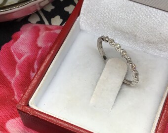 Genuine Diamond Ring set in 10k white gold.