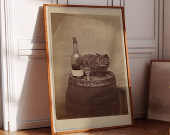 May include: A vintage black and white photograph of a cat sitting on a barrel with a bottle of liquor and a glass. The barrel is labeled "The Old Bachelor".