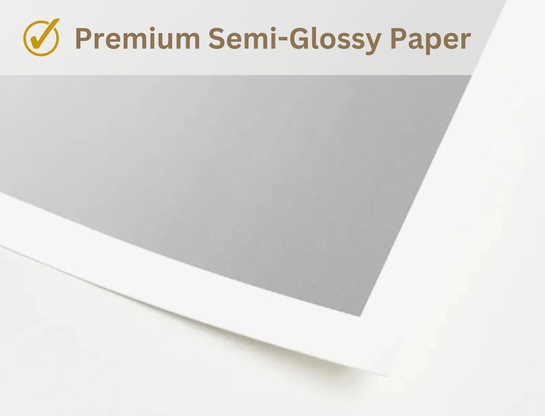 May include: A corner view of a sheet of premium semi-glossy paper. The paper has a white border and a light gray center. The text "Premium Semi-Glossy Paper" is displayed in a serif font with a checkmark icon.