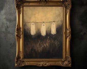 May include: A framed painting featuring three white ghost figures hanging on a clothesline against a sepia-toned background. The artwork is set within an ornate, gold-colored frame, evoking a vintage aesthetic. The painting's theme is Halloween.