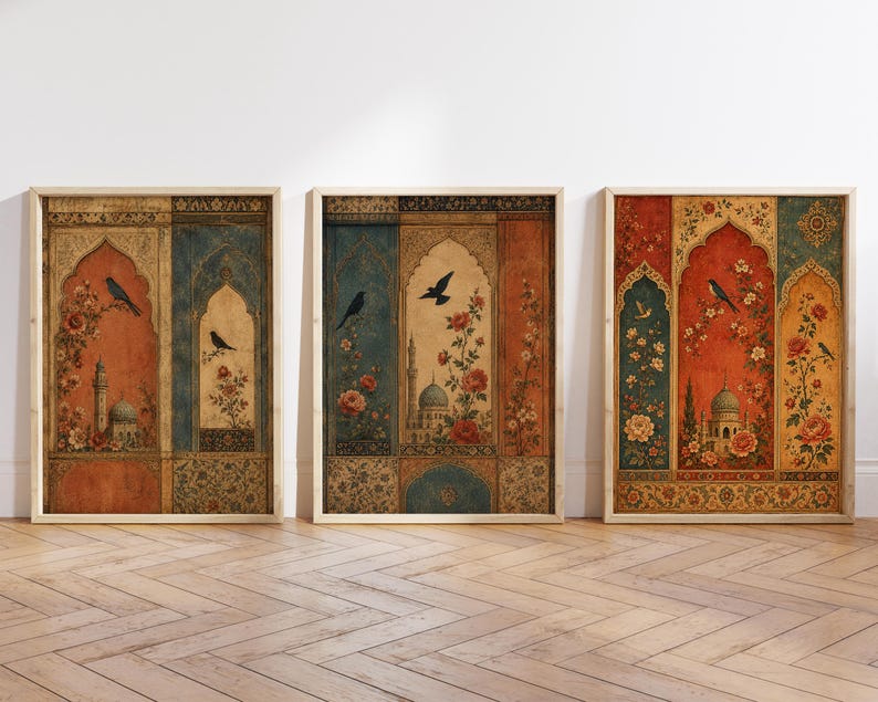 May include: Three framed art prints with an ornate, vintage design. Each print features a central archway design with a mosque, birds, and floral elements in shades of red, blue, and gold. The frames are light wood.
