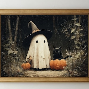 May include: A framed Halloween-themed painting. A ghost wearing a witch hat stands between two pumpkins, with a black cat perched on one. The artwork is set in a forest with a dark, muted color palette.
