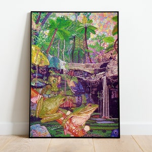 May include: A framed print of a colorful, detailed illustration of a jungle scene with two green frogs sitting on a branch. The background features lush foliage, a waterfall, and a vibrant sky.
