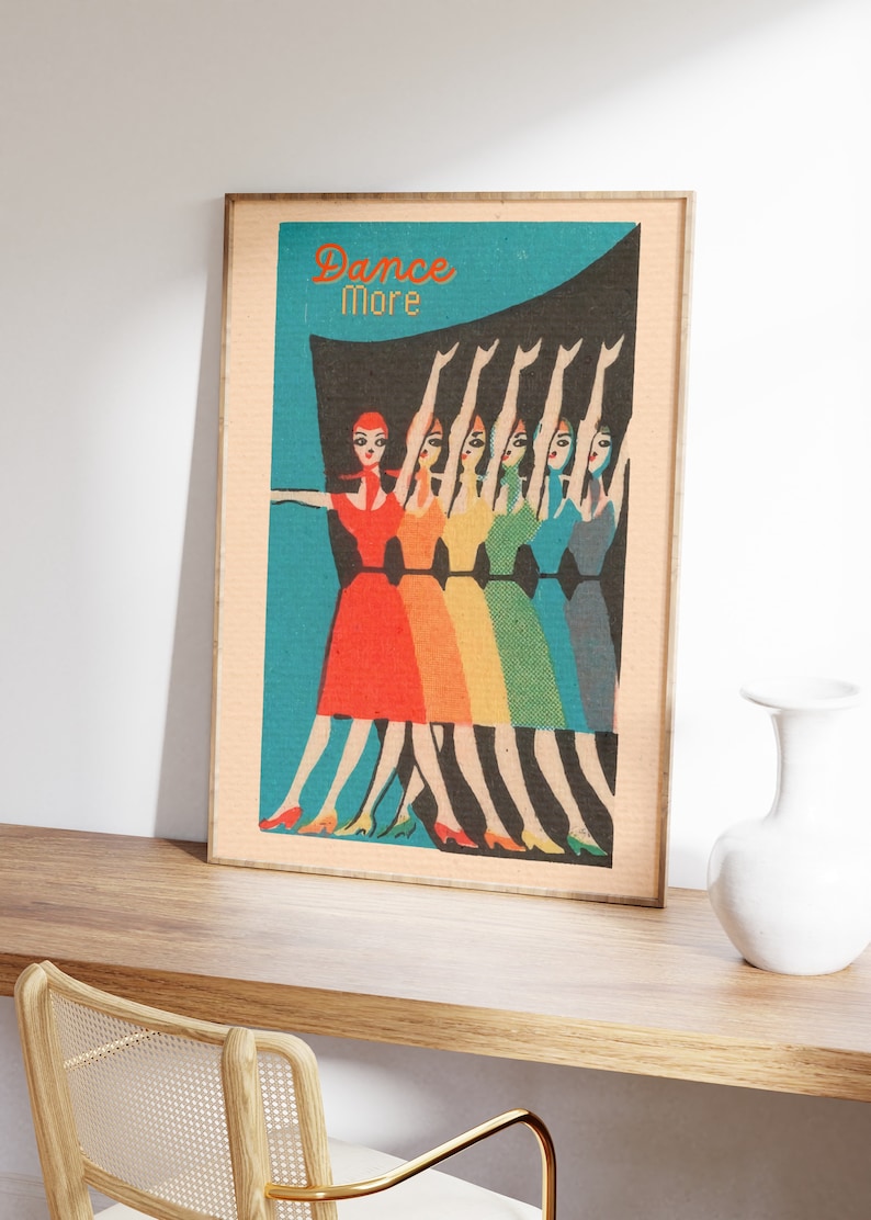 May include: A vintage poster with the text "Dance More" in orange and black. The poster features a line of women in colorful dresses dancing with their arms raised.