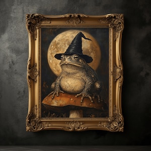 May include: A framed painting of a toad wearing a black witch's hat, sitting on a mushroom, with a full moon in the background. The artwork is set within an ornate gold frame, adding a touch of elegance.
