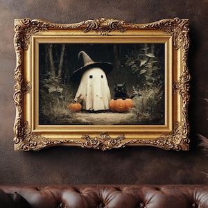 May include: A framed Halloween-themed artwork featuring a ghost wearing a witch hat, a black cat, and pumpkins. The artwork is set in a forest scene and framed in an ornate gold frame, creating a vintage aesthetic.