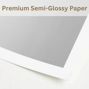 May include: A corner view of a sheet of premium semi-glossy paper. The paper has a white border and a light gray center. The text "Premium Semi-Glossy Paper" is displayed in a serif font with a checkmark icon.
