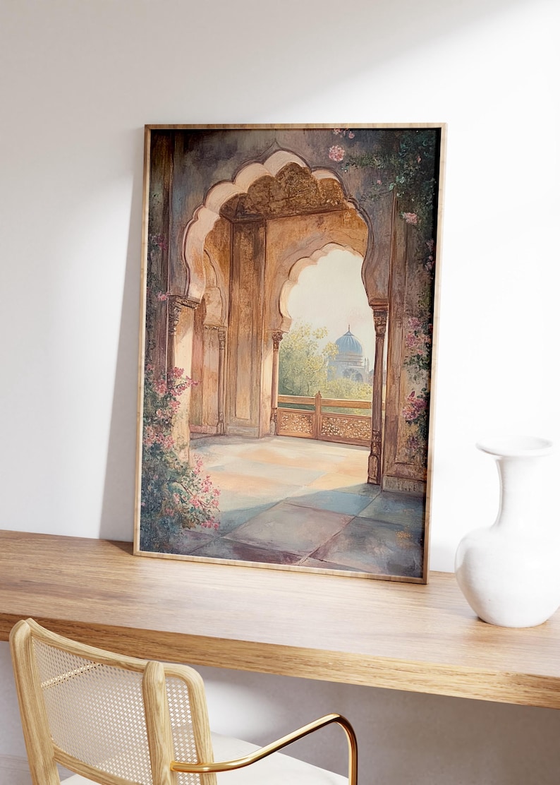 May include: A framed watercolor painting depicting a view through an ornate archway. The archway is made of stone and has intricate carvings. The view beyond the archway shows a lush garden with a domed building in the distance.