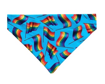 May include: A turquoise blue dog bandana with a repeating pattern of rainbow flags.